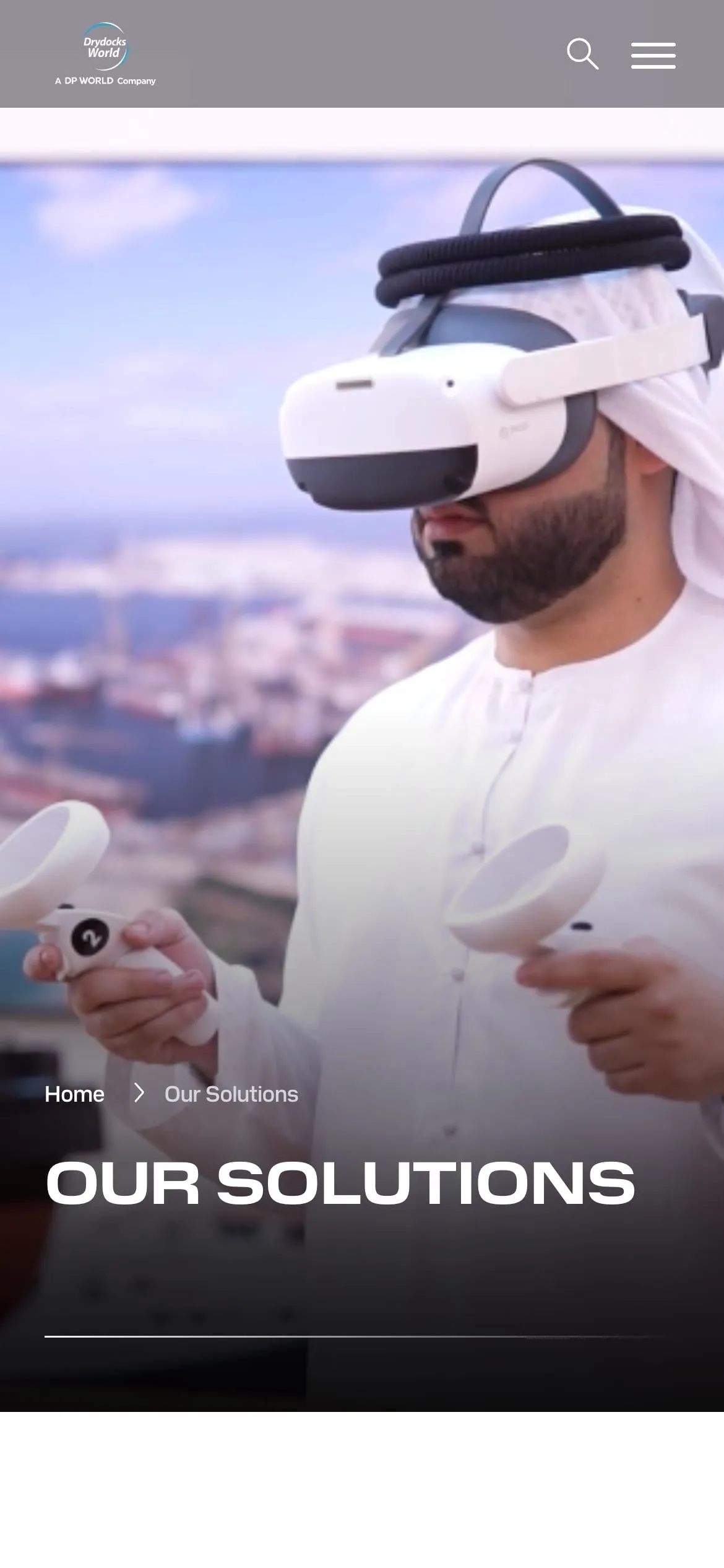 The Our solutions page on a phone, with a man in a white kandura using a virtual reality headset