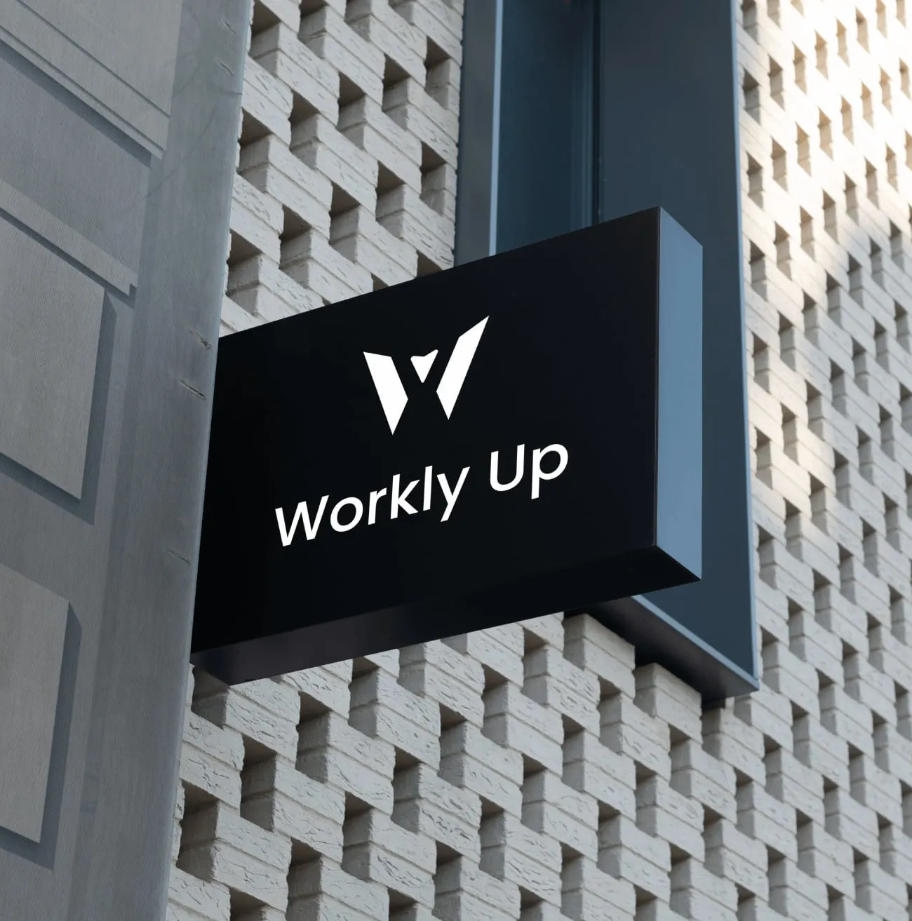 A black Workly Up sign at a building entrance