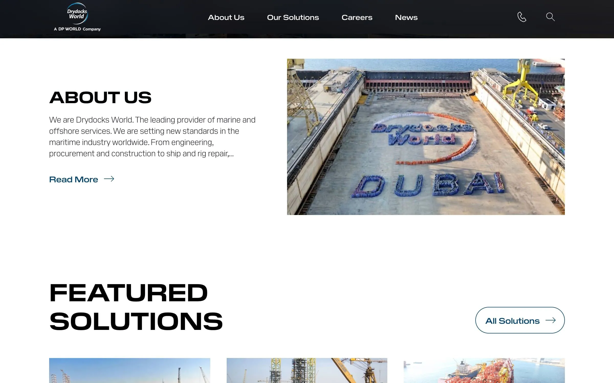 The About us section beside an aerial photo of a dry dock with Drydocks World Dubai spelled out by the crew